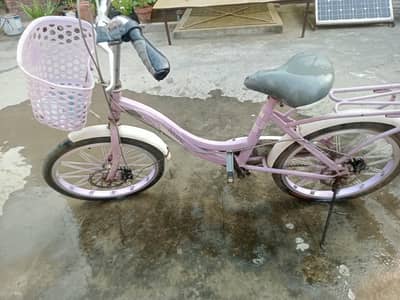 light purple girls bicycle with basket