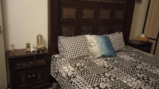 Wooden bed with side tables and dressing for sale in 55k