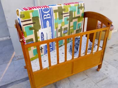 wooden baby cot is for sale