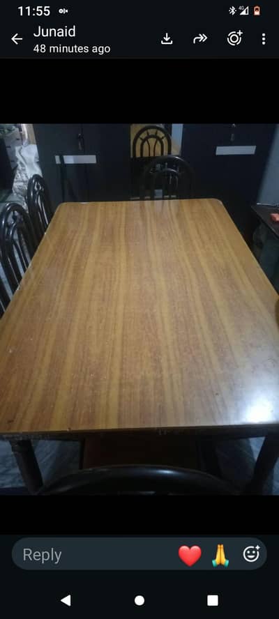 A dining table with 6 chairs