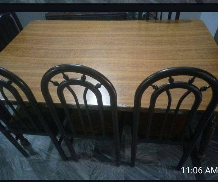 A dining table with 6 chairs 3