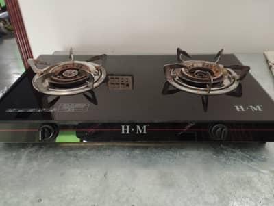 Almost new glass top double burner gas stove for sale