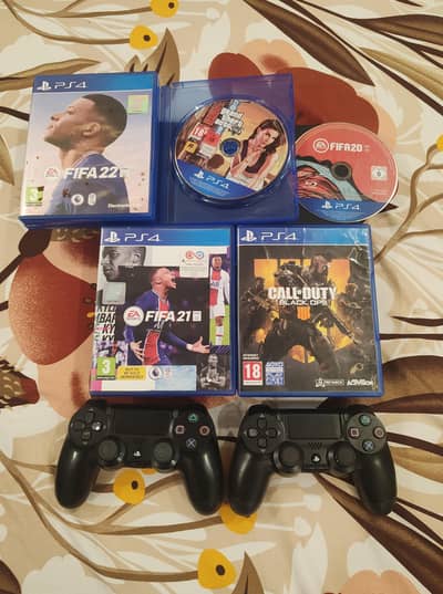 Ps4 Slim with 2 controller and 5 Disc's.