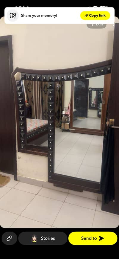 Bed with side tables and mirror