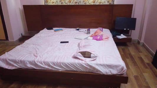 bed with mattress and dressing table