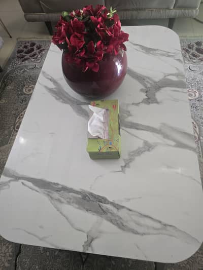 centre tab set with marble top and a storage drawer