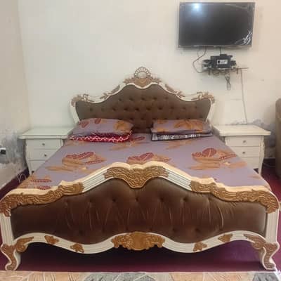 solid bed with side table and console