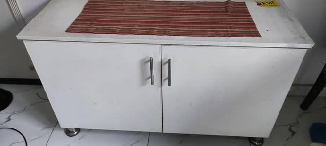 White two-door utility cabinet with metal handles