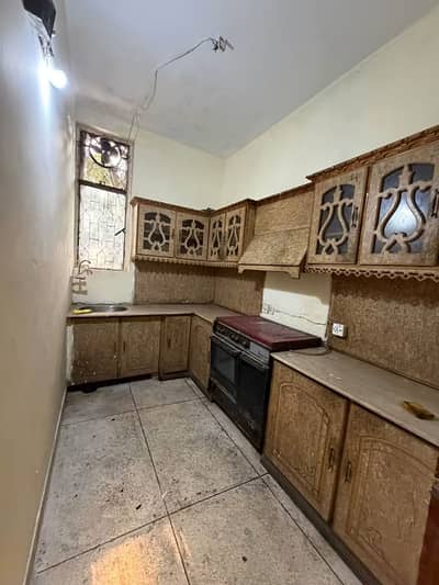 Faisal Town 1 kanal house on main commercial Rd near banks ideal for commercial use