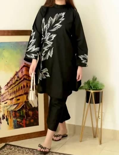 Black dress with white embroidery