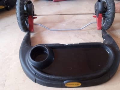 Baby stroller available for sale in grey and black colour.