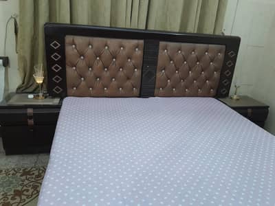 Queen bed with side tables and dressing table Also Room carpet include