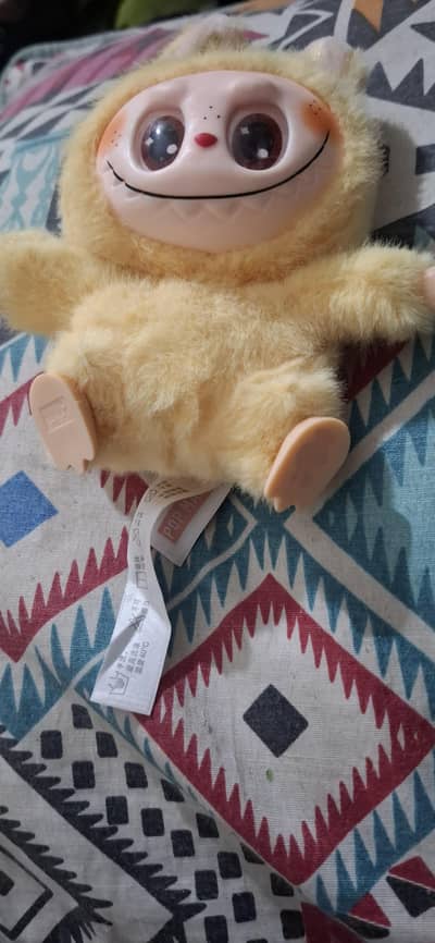 labubu doll in yellow colour