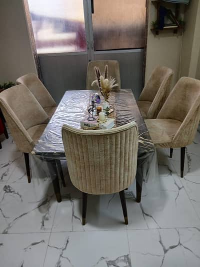 Dinning table with 6 chairs is available for sale