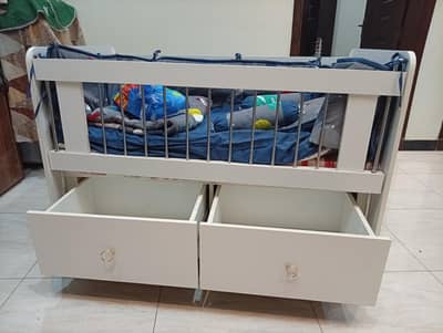 Baby cot with mattress and full bedding