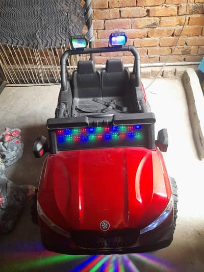 Red Kids Electric Ride-On Car with LED Lights – 2 Seater