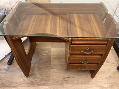 Used wooden and glass top study table in good condition