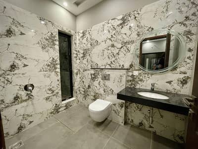 A beautifully designed modern 10 Marla, 4-Bedroom house located Block T, DHA Phase 7, Lahore.