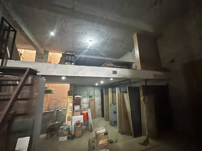 10 Marla sami Commercial Property for Sale! Spacious lower commercial hall with an upper-floor house, registry and intiqal available. Excellent location, walking distance to essential facilities. Ideal for investment and business.
