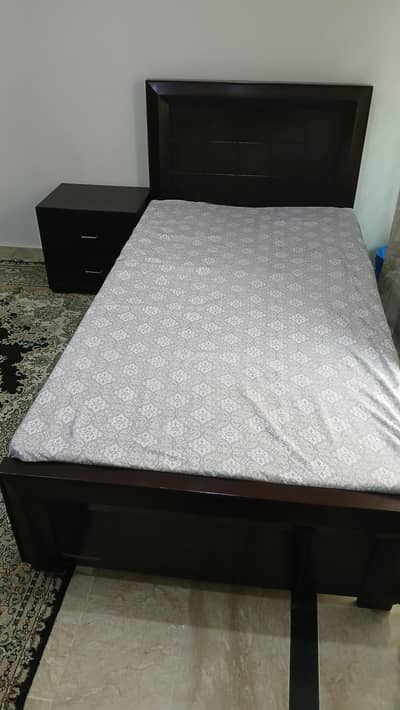 single bed with side table without matress