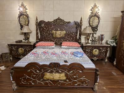 Double bed with side tables and dressing with a wardrobe