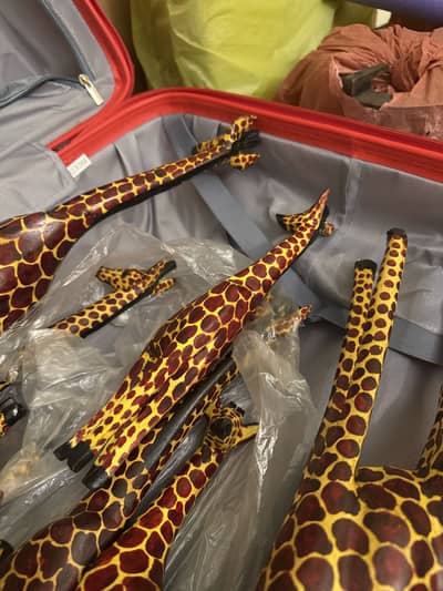 Brand new African wooden giraffes two sizes