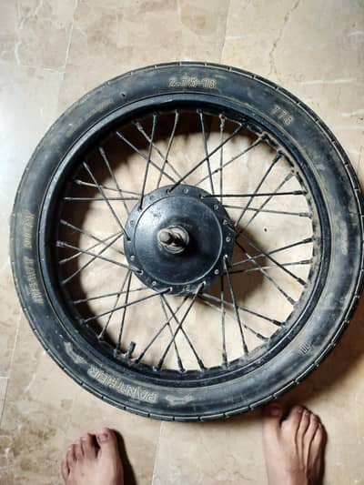Suzuki 150 Front wheel complete