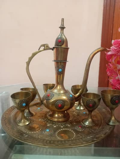 indian artistic design of keetle and mugs