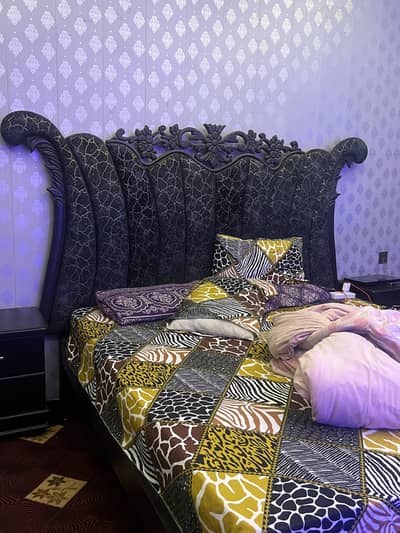 Bed with side table and dressing table