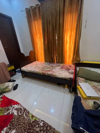 A kid s bed along with mattress and side table 1