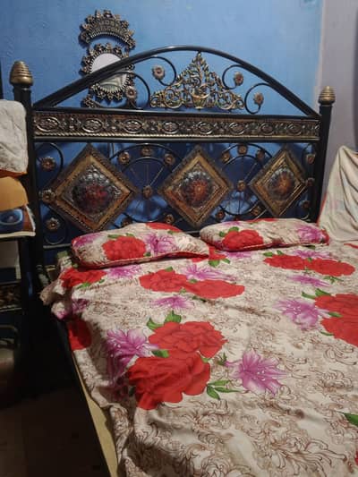 iron king size bed with side table and dressing table