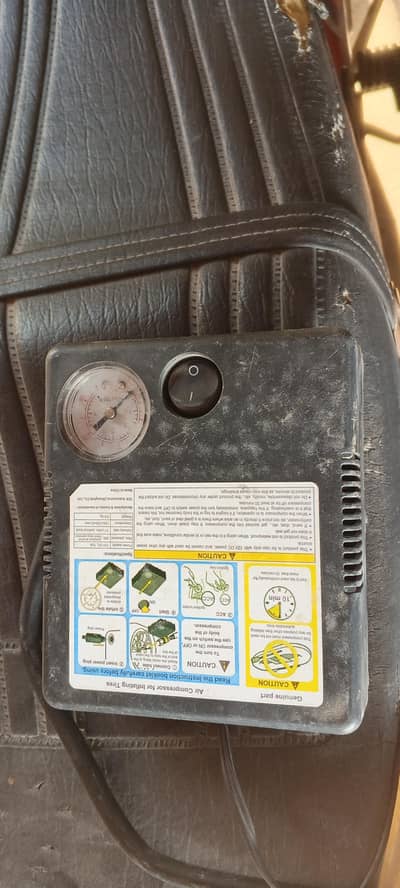 Air compressor for inflating Tyres