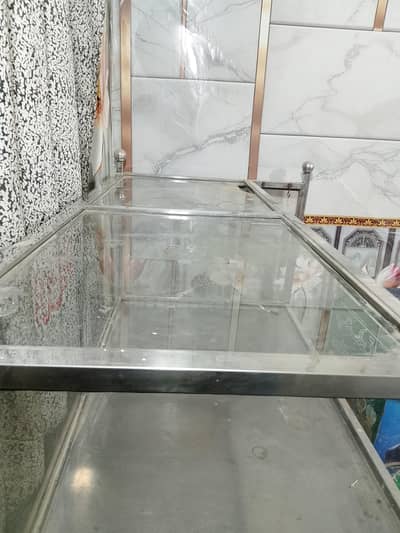 steel counter with glass frame. har kam k lie rs 155000