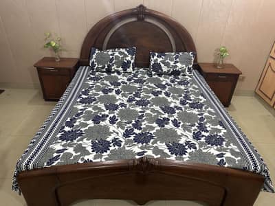 Wooden bed with side tables and dressing
