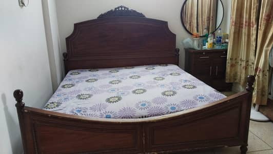 wooden bed with two side tables good condition urgent sale