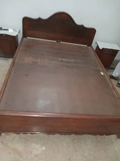 Wooden bed with side tables