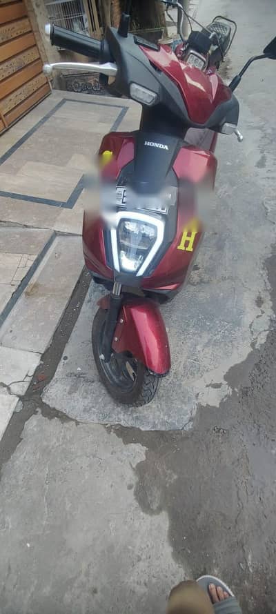 Honda icon e Scotty