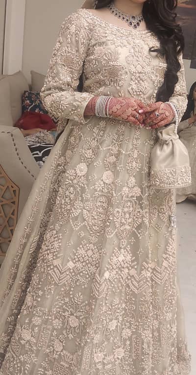 Designer baige/Ivory Heavy Embroidered Bridal lahnga with Pouch