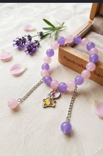 cute pink & purple bead bracelet with Jerry charm