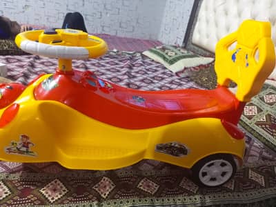 red and yellow kids car