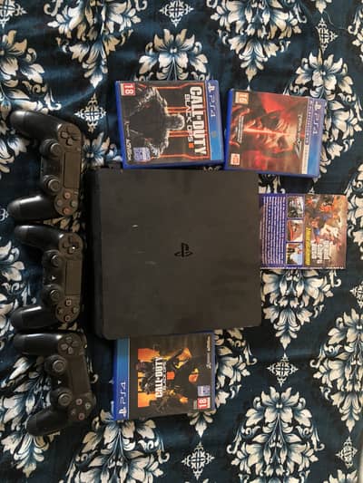 Sony PS4 slim with 3 controllers and games excellent condition