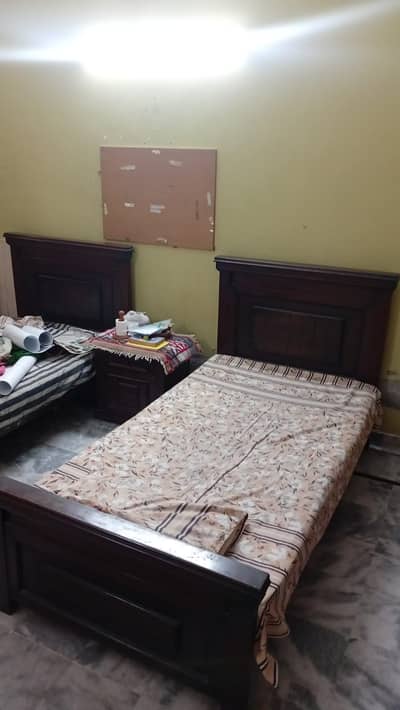 2 Single beds Solid wood in good condition