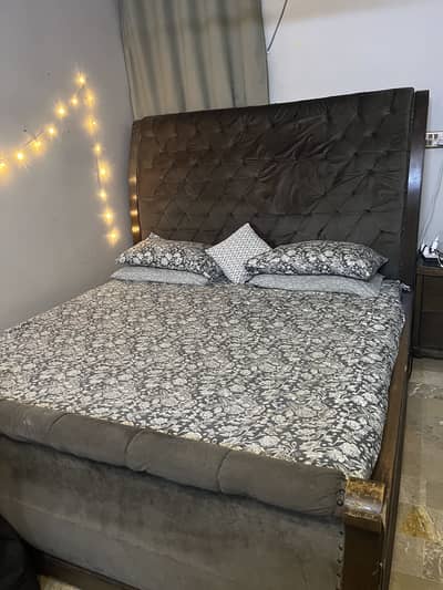 Wooden bed with side tables and dressing table