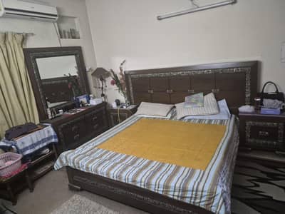 king size double bed with dressing table and side tables