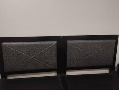 Selling two single solid wood beds