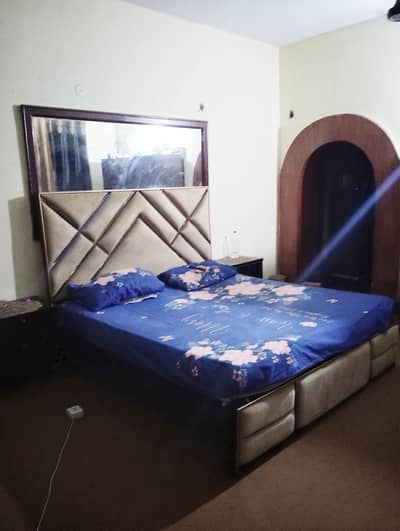 Brass bed with side table