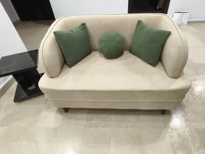 Two seater sofa (Hardly used) with 3 brand new  cushions .