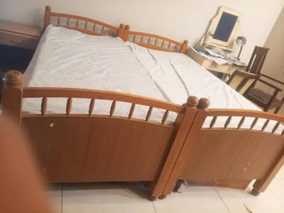2 single beds with mattress, 2 side tables and one detached side rail