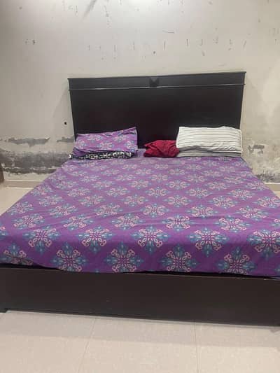 Bed with sides tabled and dressing table