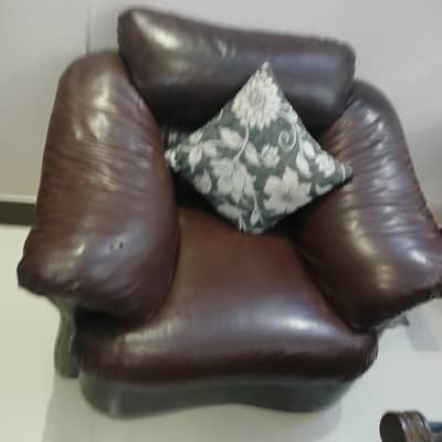 2 single seater, and one 3 seater, brown leather sofas.